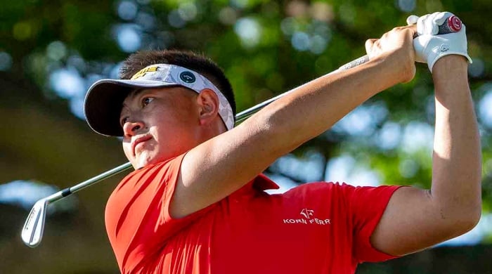 Carl Yuan hits his tee shot on the second hole during the final round of the 2024 Sony Open in Hawaii at Waialae Country Club.